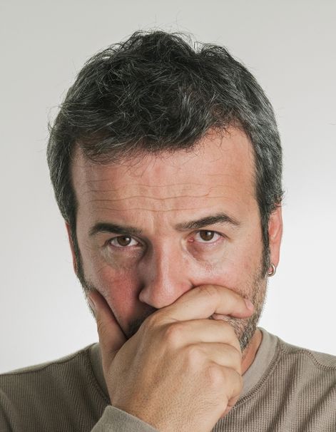 A husband covers his face as his mouth worried with guilt. This could represent the support an affair recovery expert can offer with affair recovery in Boca Raton, FL. 33179 | 33180 | 33311