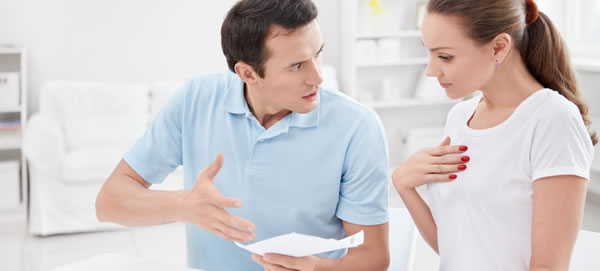 A couple appear to argue as they look at a paper. This could symbolize when you have a parent-child relationship with your spouse. Learn more about online relationship therapy in Florida from a couples therapist in Florida today. 33908 | 33180 | 33311