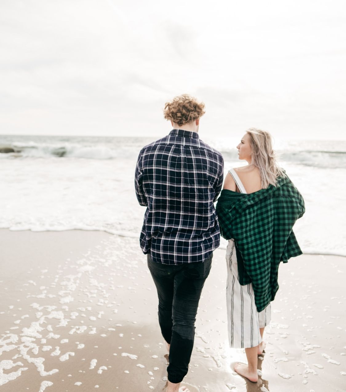 A couple walk together towards the short. Contact Idit Sharoni to learn more about recovering from infidelity in Florida, infidelity counseling, and other services. We would be happy to support you! 33179 | 33160 | 33180
