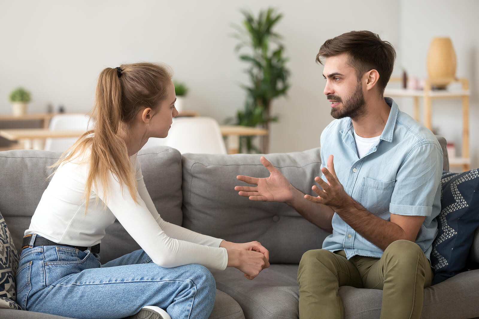 Shows a couple having a discussion about their boundaries before the holidays. Represents how a couples therapist in florida will help you and your partner navigate any issues that arise before the holidays.