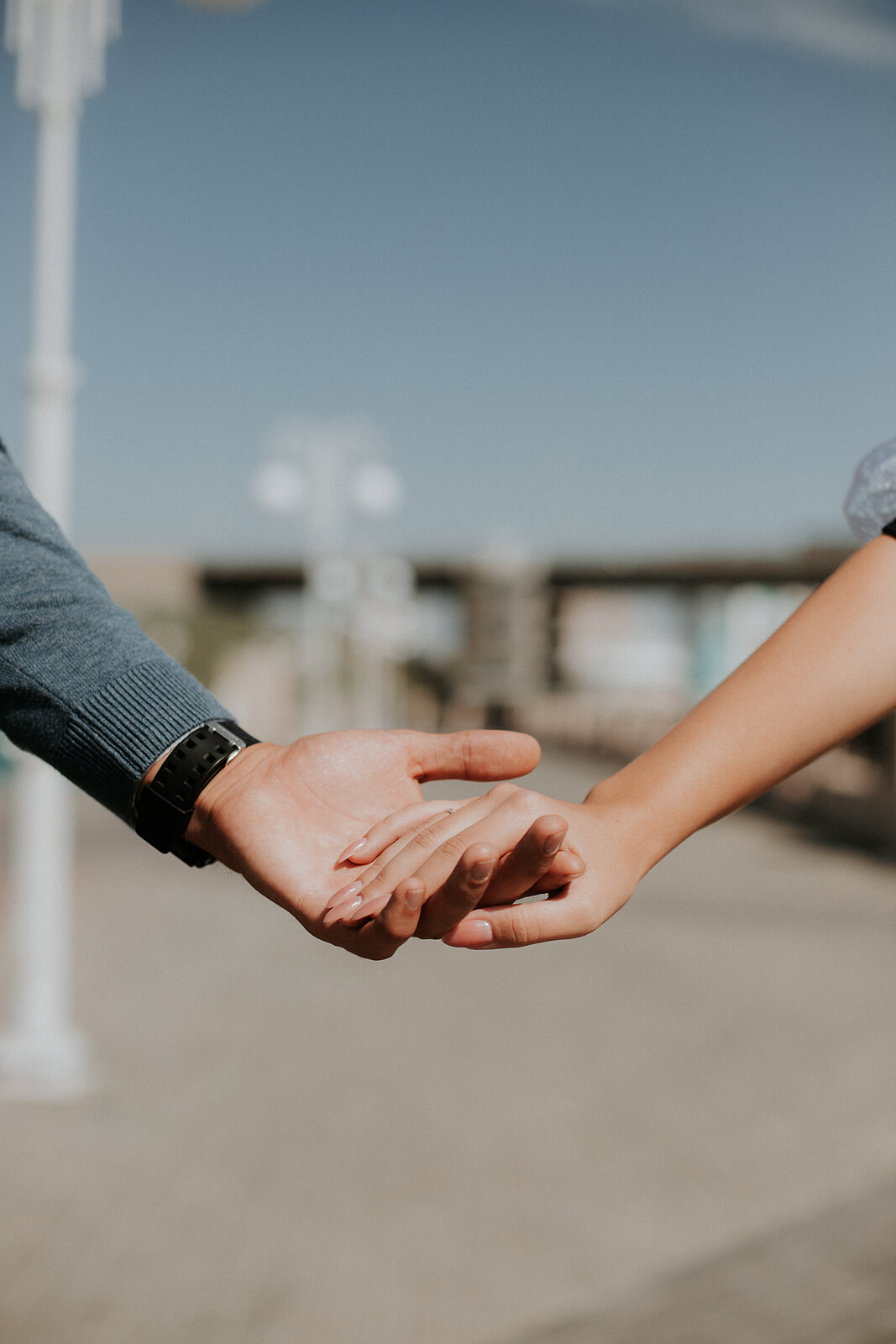 Photo of a couple holding hands outside. Are you and your partner struggling in your relationship? Learn tips from a marriage counselor in Miami, FL on how to strenghten your relationship.