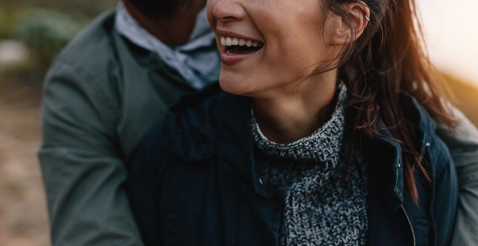 Photo of a couple hugging and smiling outside. Are you and your partner facing barriers when it comes to connecting? Discover how you can connect and create intimacy with your partner with marriage counseling in Miami, FL.