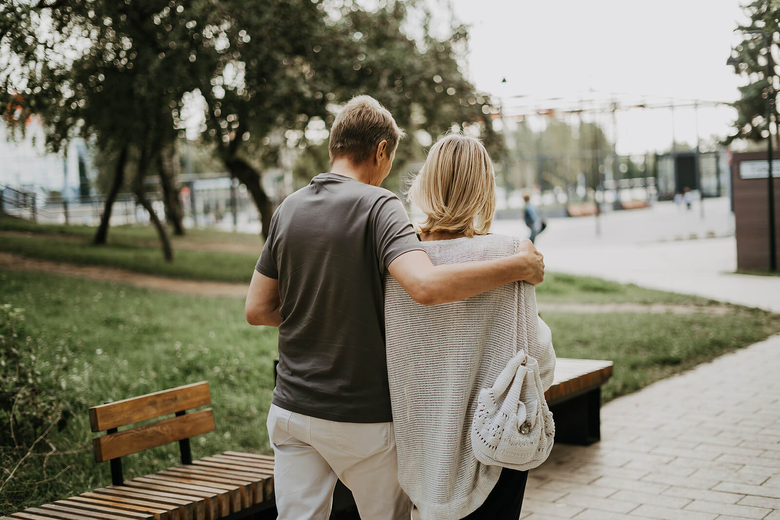Photo of a couple walking outside with the man's arm draped over the woman's shoulders. If you are looking for new ways to improve communication in your relationship, learn tips from a communication therapist in Florida. Discover how communication can help you reconnect.
