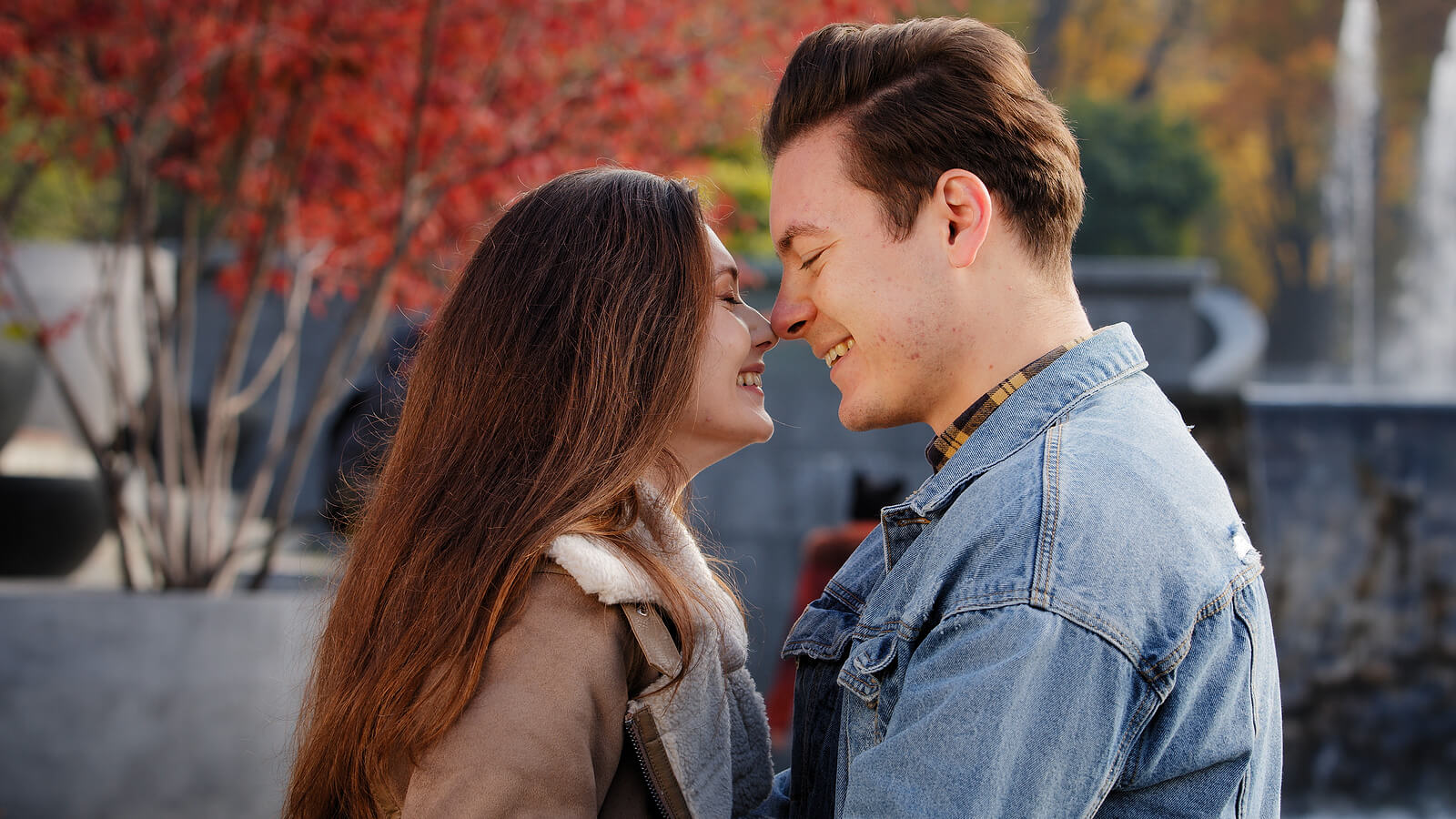 Photo of a couple standing outside smiling with their noses together. If you and your partner are struggling to repair your relationship after infidelity, learn how a skilled therapist can help you begin repairing your relationship and provide support with infidelity recovery program in Florida.