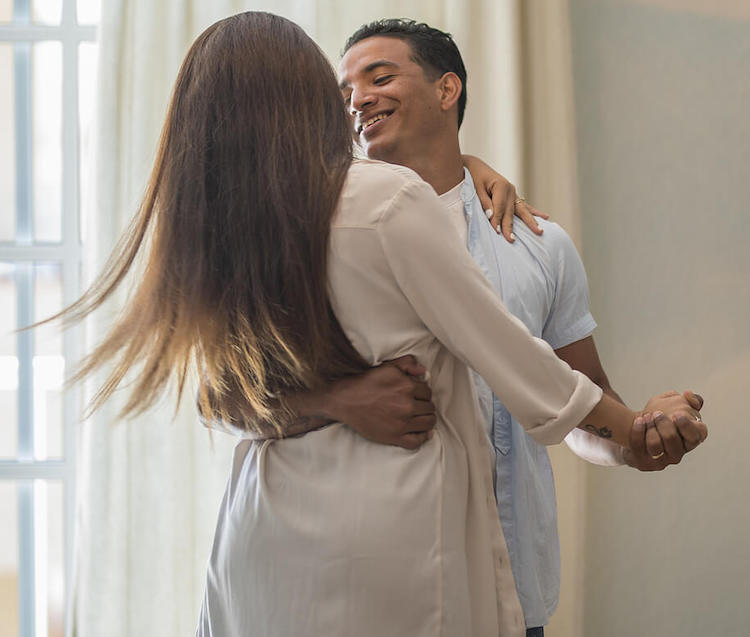 Happy couple smiling and dancing. Uncover new ways to connect with your partner and help with your relationship ruts with the help of a couples therapist in couples therapy in Miami, FL.