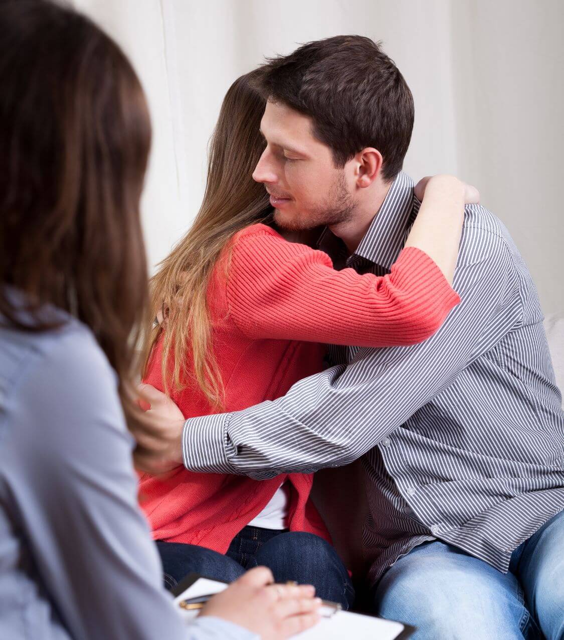 Image of a couple hugging in couples therapy. If you struggle with communication and its affecting your intimacy, learn how couples therapy in Miami, FL can help!