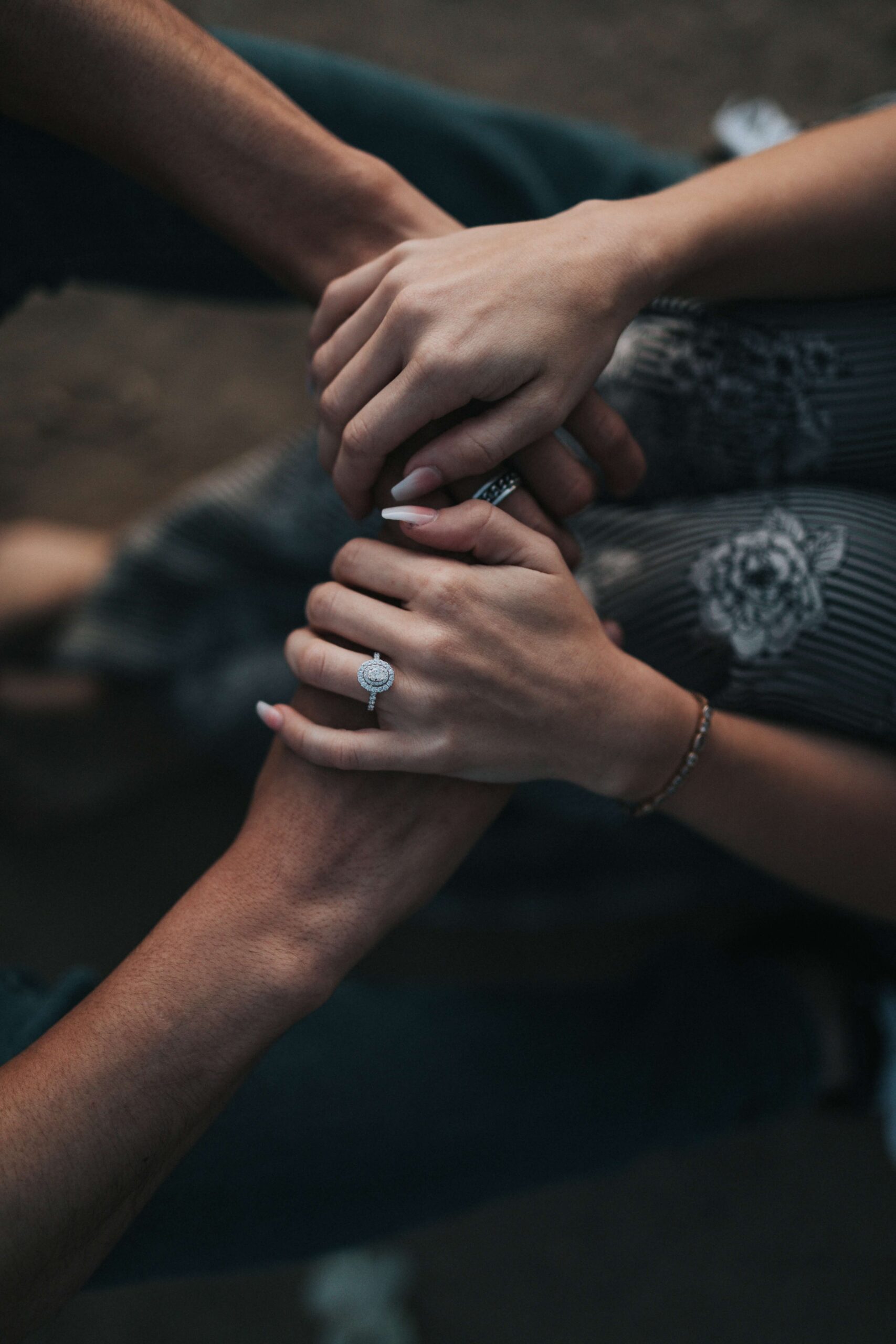 Image of a woman's hands over a man's hands. If you and your partner struggle with resentment in your relationship, discover how marriage counseling in Miami, FL can help you.