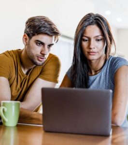 Focused couple on a video call discussing relationship goals. Discover online marriage therapy advantages and learn if couples therapy in person or online works best. Strengthen your relationship in Fort Lauderdale, Tampa, Orlando, or Sarasota today.