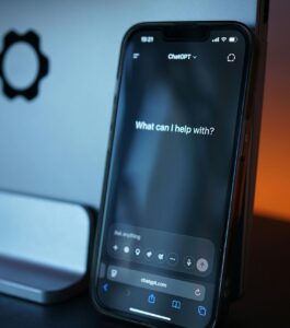 Smartphone screen displaying an AI chat prompt, illustrating the issue of a partner finding AI chat history and getting upset, highlighting AI comes between a couple, Digital Relationship Boundaries, and can AI use become a problem in a relationship for couples in Naples, Tampa, Lakeland, West Palm Beach, Miami, Key West, Orlando, Port Saint Lucie, and Tallahassee. Schedule a free call with Relationship Experts now.