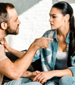 A man pointing at his partner during a tense argument after an affair, showing signs a marriage may be over. Can my marriage be saved? Couples therapy helps you heal after infidelity and find clarity. Serving couples in Pembroke Pines, West Palm Beach, and Boca Raton. Reach out for help today.