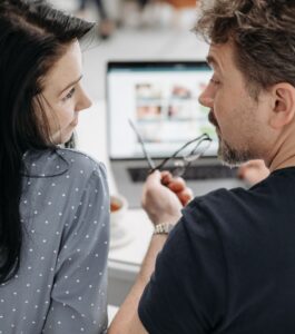 A man and woman face each other in serious conversation at a desk with a laptop. Capturing the emotional weight of a couple considering whether online therapy can deliver real results. Couples therapy online has been shown to work as well as office therapy, giving couples in Ft. Lauderdale, Boca Raton, and West Palm Beach FL access to specialty online couples therapy without compromise. If you're wondering whether a relationship can grow after cheating, our specialist team is here to help you today.